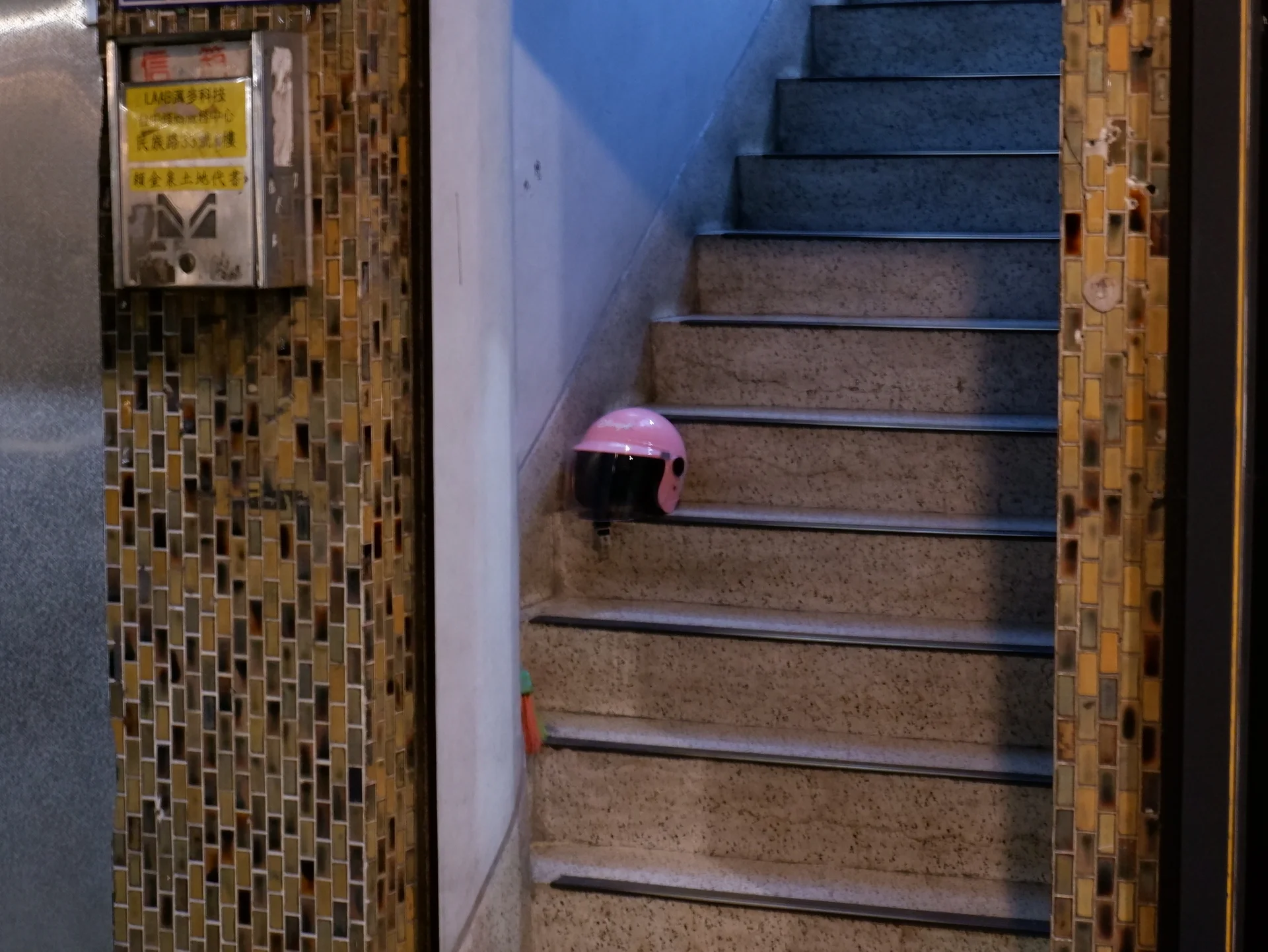 A pink helmet near a stairway